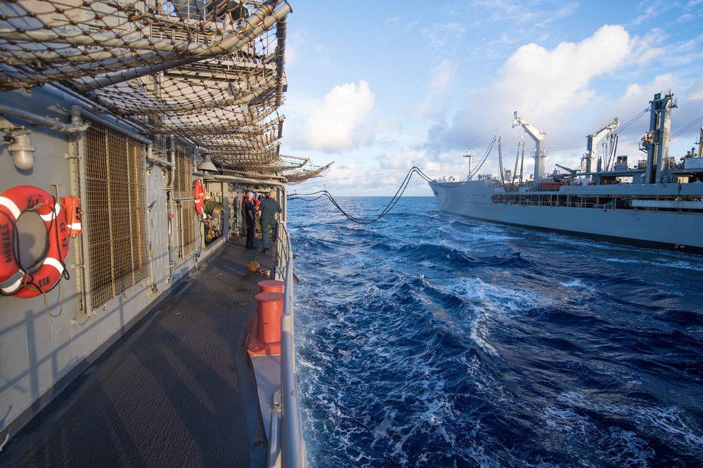 USS Mobile Bay (CG 53) conducts a replenishment-at-sea with the fleet replenishment oiler USNS Guadalupe (T-AO 200).