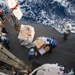 Sailors unload pallets of supplies during a replenishment-at-sea USNS Guadalupe (T-AO 200) aboard USS Mobile Bay (CG 53).