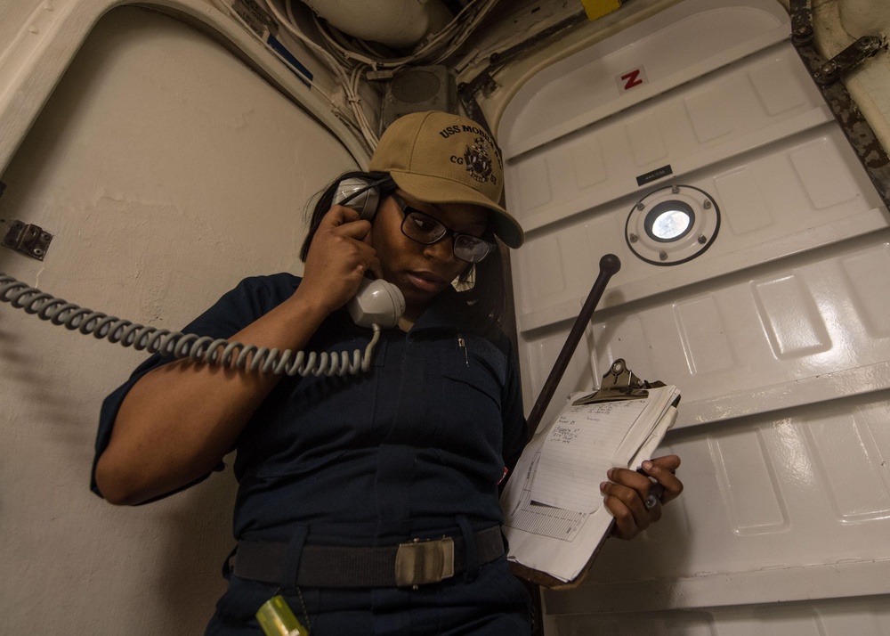 Gas Turbines Systems Technician (Electrical) 3rd Class Ronesha Patterson calls Central Control Station (CCS) to report flooding aboard USS Mobile Bay (CG 53).