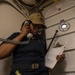 Gas Turbines Systems Technician (Electrical) 3rd Class Ronesha Patterson calls Central Control Station (CCS) to report flooding aboard USS Mobile Bay (CG 53).