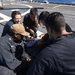 Sailors repair a wire along the electrical cable assembly aboard the flight deck of USS Mobile Bay (CG 53).