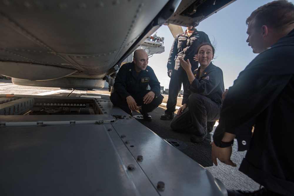 Sailors troubleshoot rapid securing devices aboard the flight deck of USS Mobile Bay (CG 53).