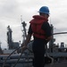 Seaman Tyler Gelinas handles line aboard USS Chung-Hoon (DDG 93) during a replenishment-at-sea.