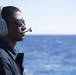 Logistics Specialist Seaman Isaiah Anthony stands watch as a forward lookout aboard USS Spruance (DDG 111).