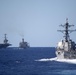 USS Chung-Hoon (DDG 93), right, steams towards USS John C. Stennis (CVN 74), left, and USNS Guadalupe (T-AO 200) for a replenishment-at-sea.