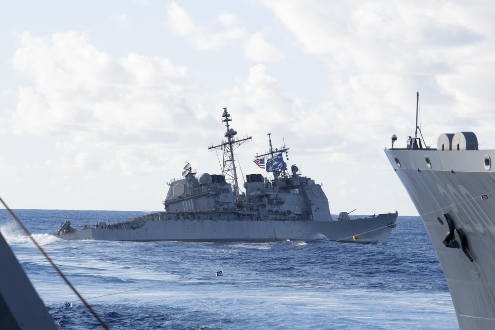 USS Mobile Bay (CG 53) practices an emergency breakaway following a replenishment-at-sea with USNS Guadalupe (T-AO 200).