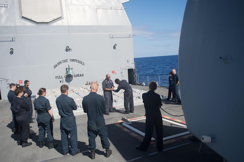 Sailors learn Mechanical Advantage Control Hold (MACH) takedowns as part of the security reaction force basic training aboard the Ticonderoga-class guided-missile cruiser USS Mobile Bay (CG 53).