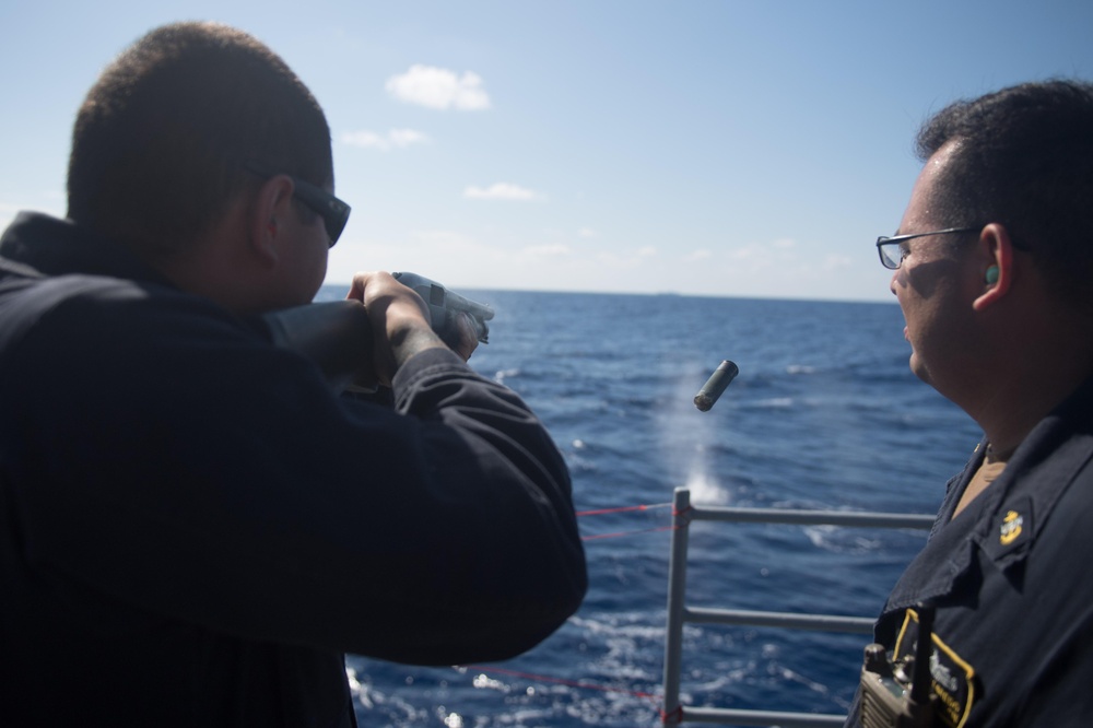 Fire Controlman (Ageis) 2nd Class Alex Jones qualifies on the M500 Shotgun aboard USS Mobile Bay (CG 53).