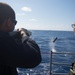 Fire Controlman (Ageis) 2nd Class Alex Jones qualifies on the M500 Shotgun aboard USS Mobile Bay (CG 53).