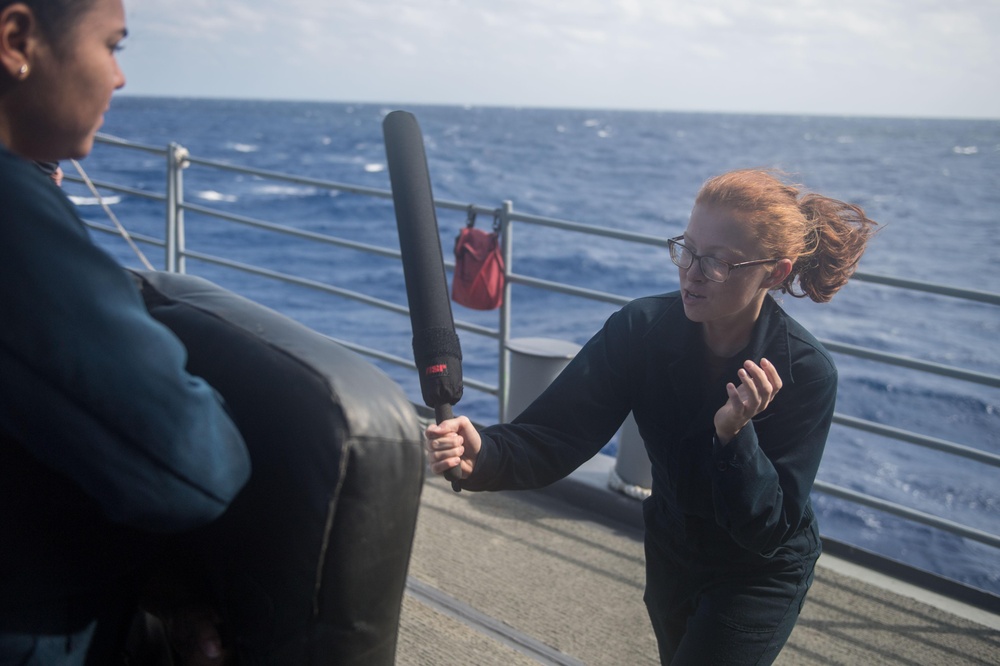 Cryptologic Technician (Technical) 3rd Class Isabel Hammock practices a striking movement aboard USS Mobile Bay (CG 53).