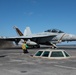 Rear Adm. Michael Wettlaufer, commander, Carrier Strike Group (CSG) 3, and Capt. Steven Hejmanowski, commander, Carrier Airwing (CVW) 9, prepare to take off in an EA-18G Growler from USS John C. Stennis (CVN 74).