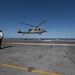 An MH-60S Knight Hawk, with Helicopter Sea Combat Squadron (HSC) 14, takes off from the flight deck aboard USS John C. Stennis (CVN 74).