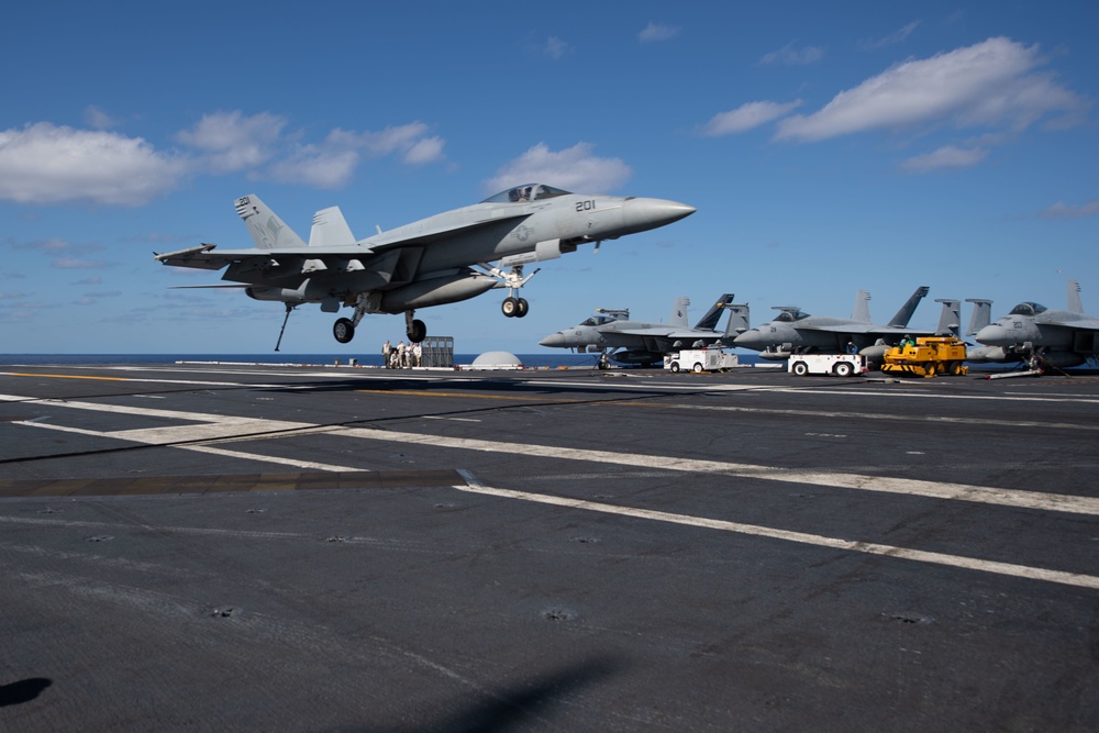 An F/A-18E Super Hornet, with Strike Fighter Squadron (VFA) 14, lands on the flight deck aboard USS John C. Stennis (CVN 74).