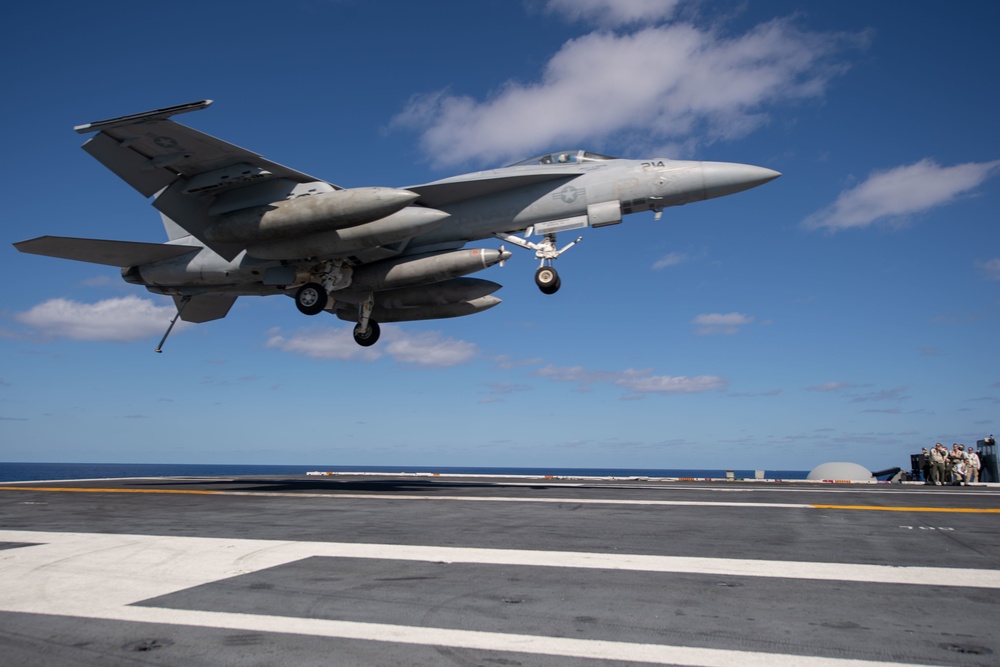 An F/A-18E Super Hornet, with Strike Fighter Squadron (VFA) 14, prepares to land on the flight deck aboard USS John C. Stennis (CVN 74).