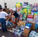 Volunteers Hand Out Supplies At Lynn Haven POD