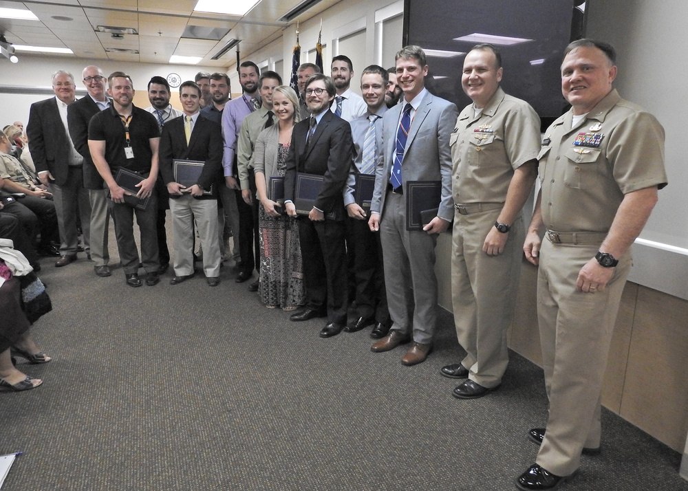 NSWC Commander and Executive Director present Awards after Hurricane Michael