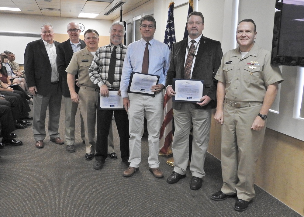 NSWC Commander and Executive Director present Awards after Hurricane Michael