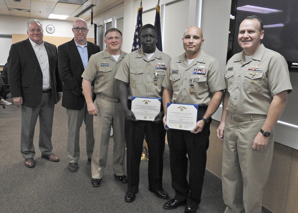 NSWC Commander and Executive Director present Awards after Hurricane Michael