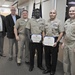 NSWC Commander and Executive Director present Awards after Hurricane Michael