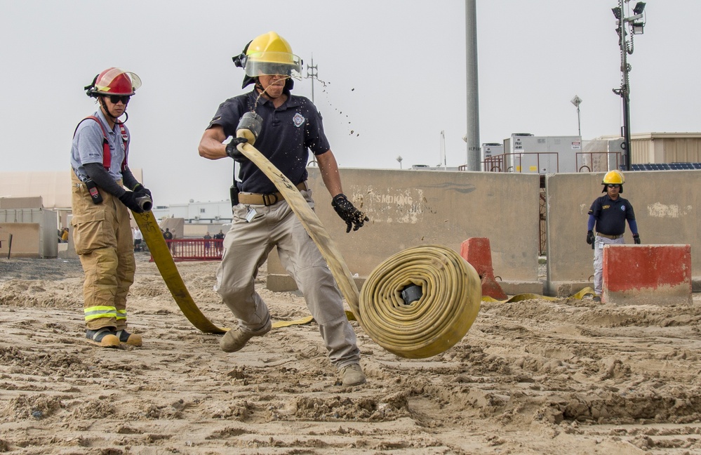 Soldiers and Firefighters Clean up After Flooding at Camp Arifjan