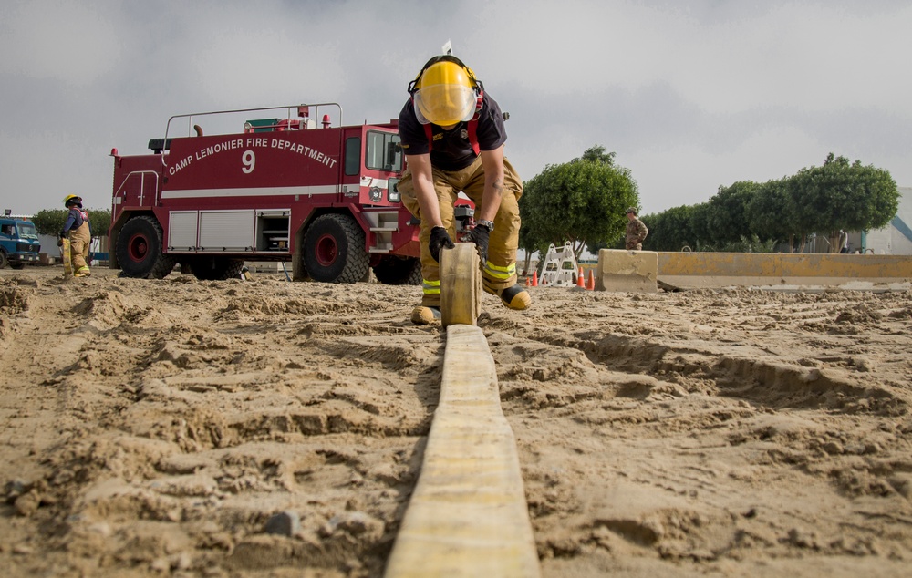 Soldiers and Firefighters Clean up After Flooding at Camp Arifjan