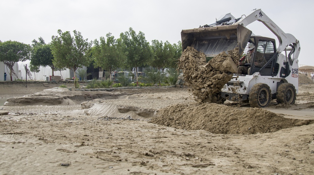 Soldiers and Firefighters Clean up After Flooding at Camp Arifjan