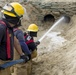 Soldiers and Firefighters Clean up After Flooding at Camp Arifjan