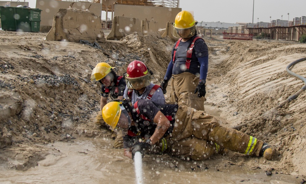 Soldiers and Firefighters Clean up After Flooding at Camp Arifjan