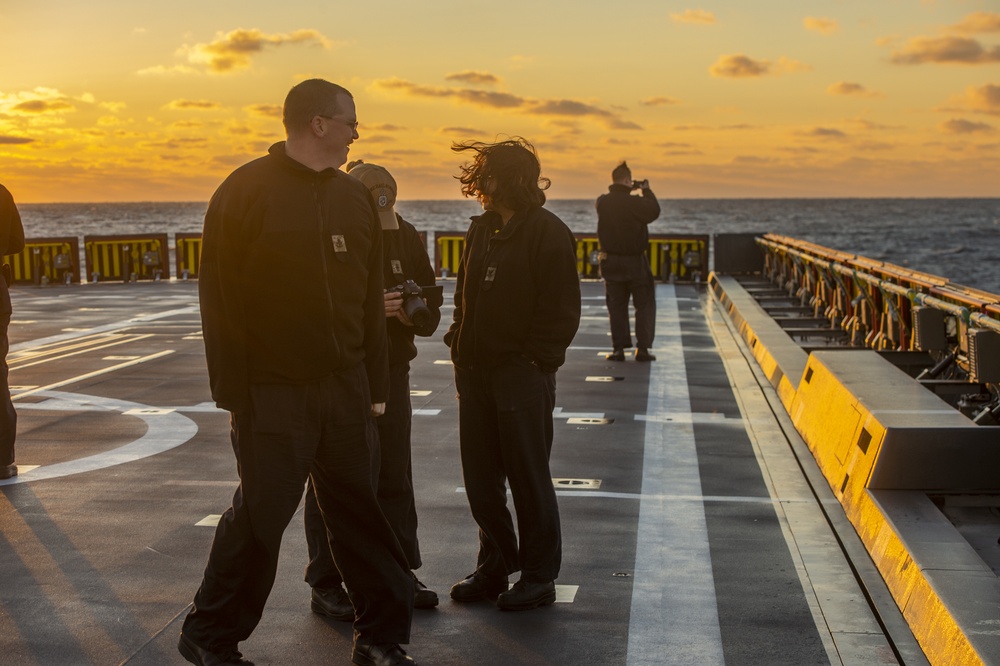 Sailors at Sunset on Flight Deck