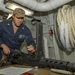 Sailor Conducts Gun Maintenance