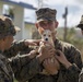 Marine Holds Adopted Puppy after Super Typhoon Yutu