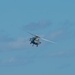 An MH-60S Knight Hawk, with Helicopter Sea Combat Squadron (HSC) 14, flies during a dual carrier strike force exercise. John C. Stennis is underway and conducting operations in international waters as part of a dual carrier strike force exercise.