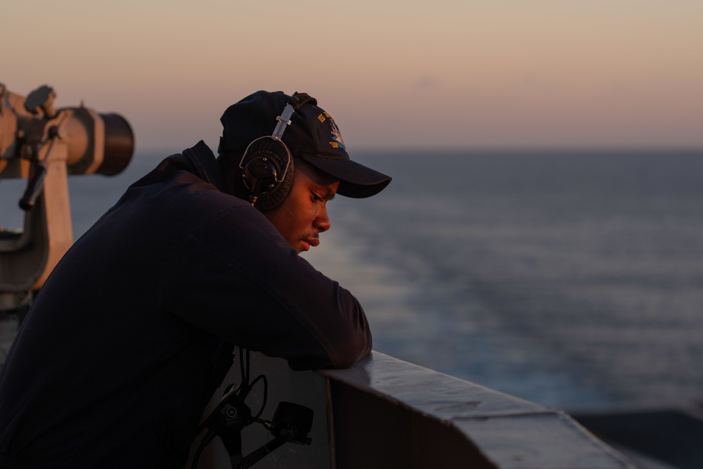 Seaman Apprentice Elijah King stands watch aboard USS John C. Stennis (CVN 74).