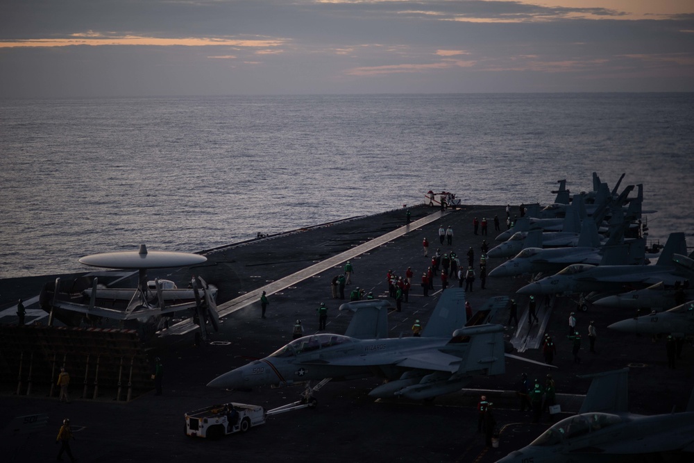 An E-2C Hawkeye, with Carrier Airborne Early Warning Squadron (VAW) 117, prepares to take off from the flight deck aboard USS John C. Stennis (CVN 74).