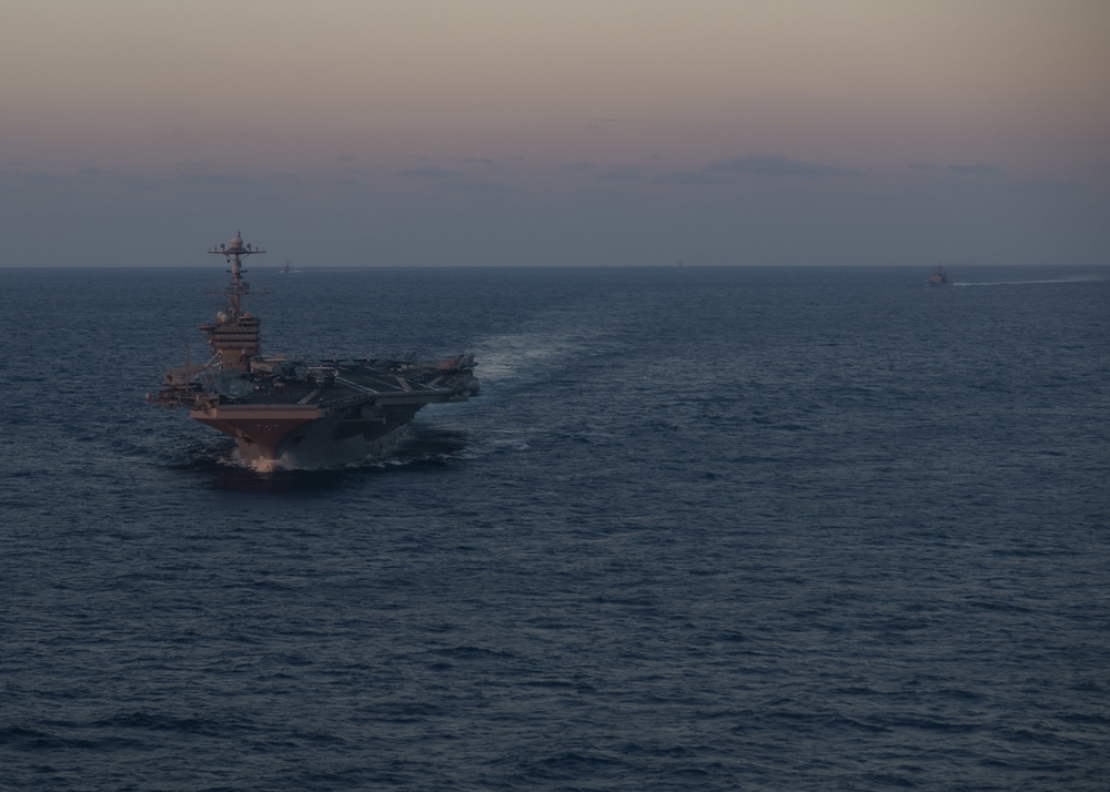 Ships of the John C. Stennis Carrier Strike Group transit the Philippine Sea.