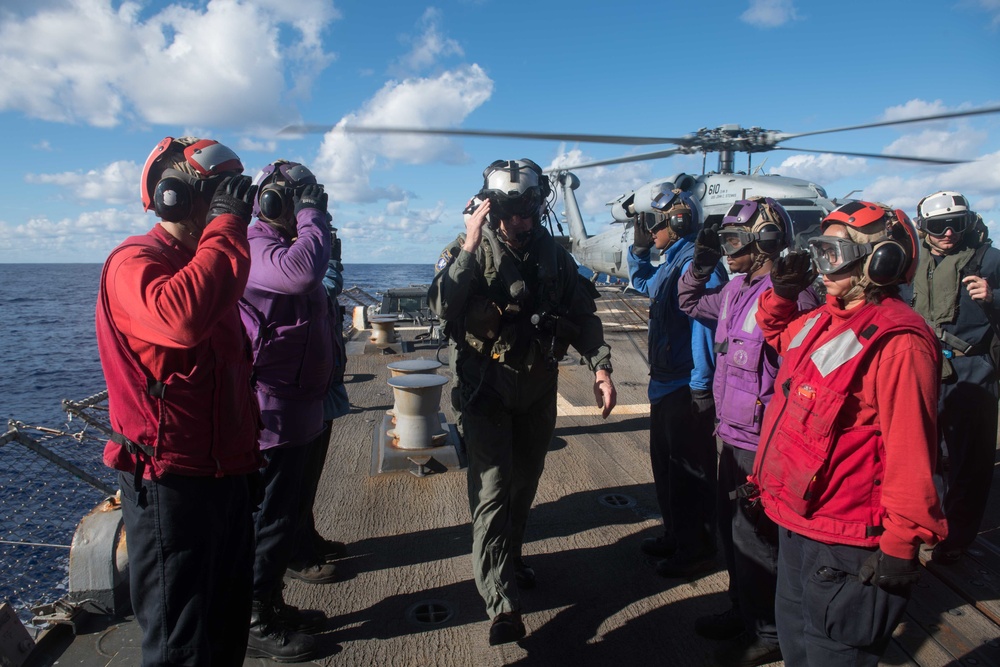 Commander, Carrier Strike Group 3, Rear Adm. Mike Wettlaufer, is piped aboard on the flight deck of USS Chung-Hoon (DDG 93).