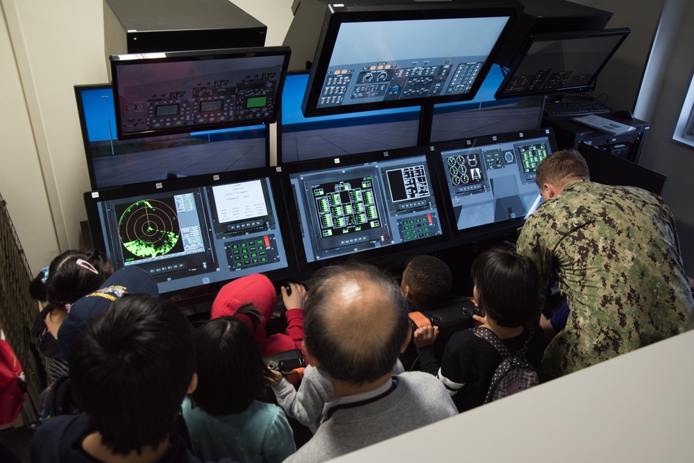 Children take a tour of Naval Beach Unit 7 facilities