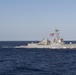USS Stockdale (DDG 106) cuts through the Philippine Sea while sailing in formation.