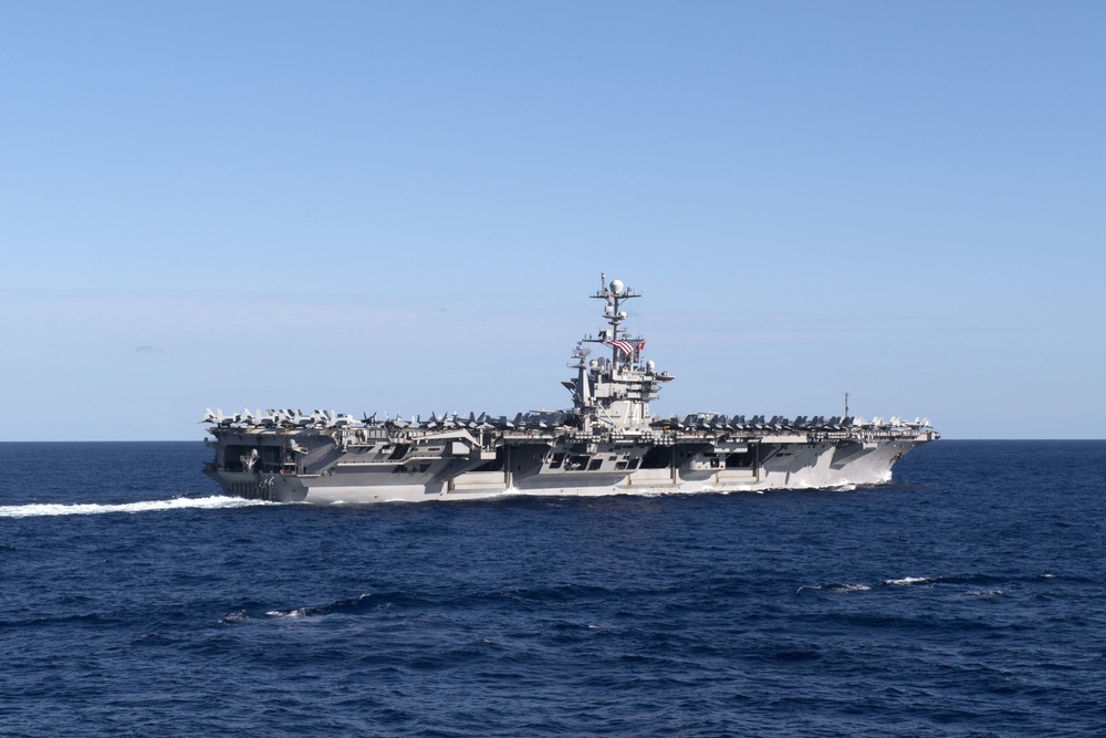 USS John C. Stennis (CVN 74) cuts through the Philippine Sea during formation sailing.