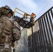 U.S. Border Patrol stands watch during border fence reinforcement