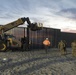 U.S. Border Patrol stands watch during border fence reinforcement