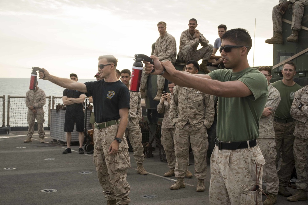 Marines get sprayed with OC on the flight deck