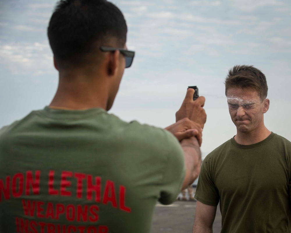 Marines get sprayed with OC on the flight deck