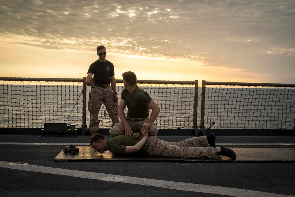 Marines get sprayed with OC on the flight deck