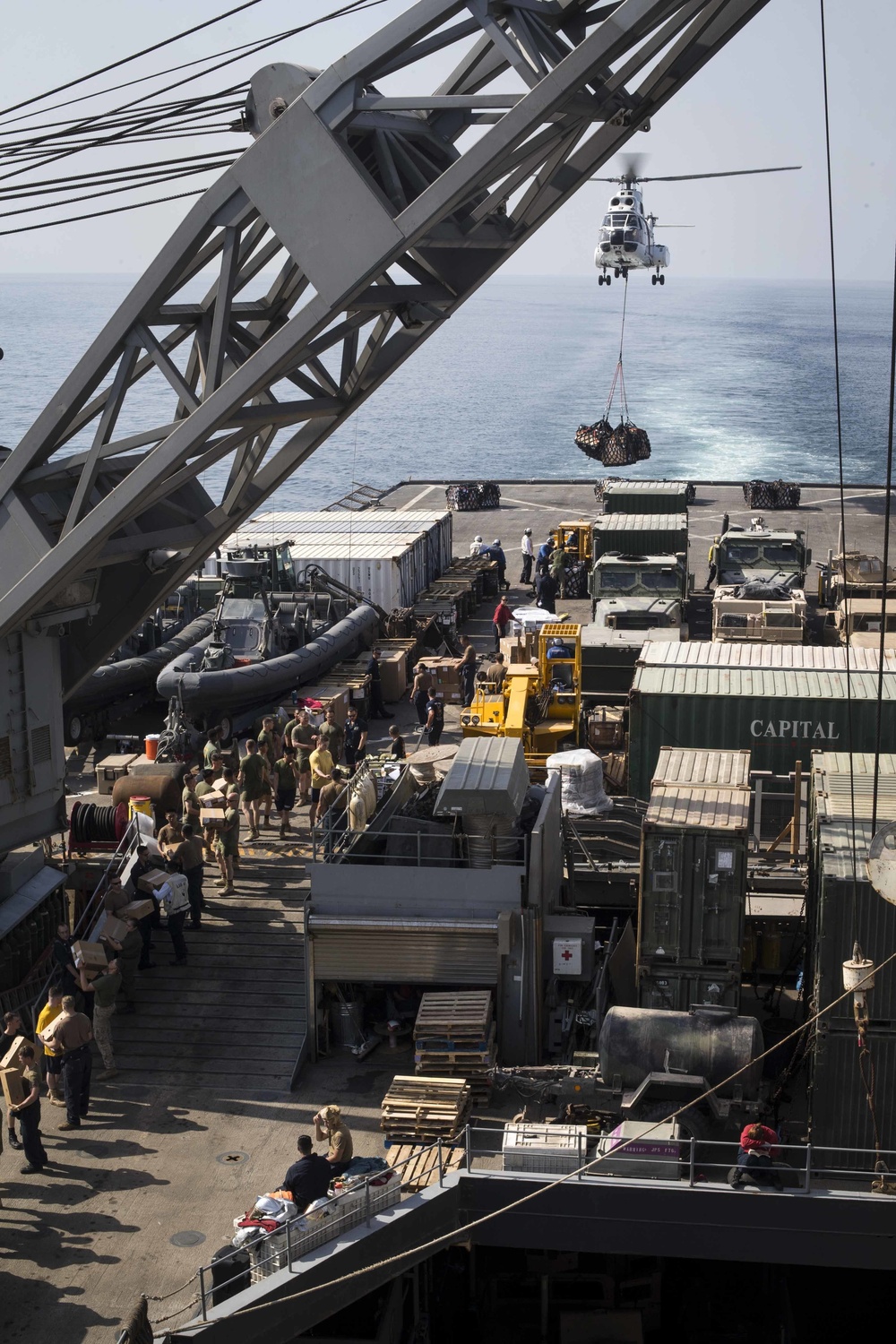 U.S. Marines and Sailors resupply at sea