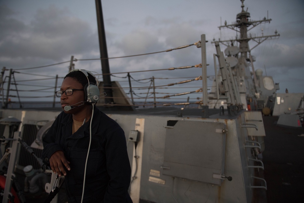 Yeoman Seaman Nadia Minor stands lookout on the aft missile deck of USS Chung-Hoon (DDG 93).