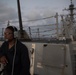 Yeoman Seaman Nadia Minor stands lookout on the aft missile deck of USS Chung-Hoon (DDG 93).