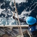 Boatswain’s Mate Seaman Ciara Heath cuts a line at a refueling station aboard USS Chung-Hoon (DDG 93) during a replenishment-at-sea.