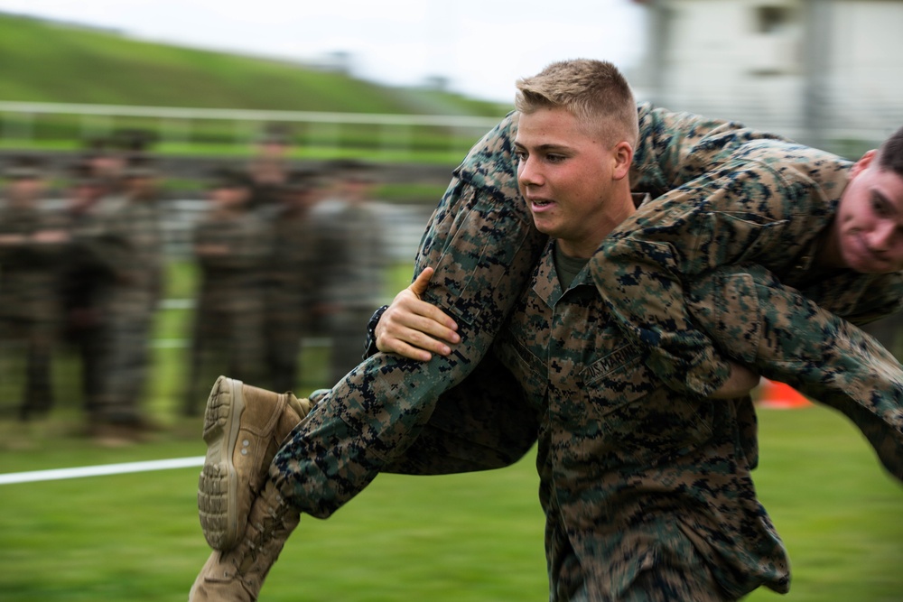 Marines with 3rd Marine Division compete in a field meet