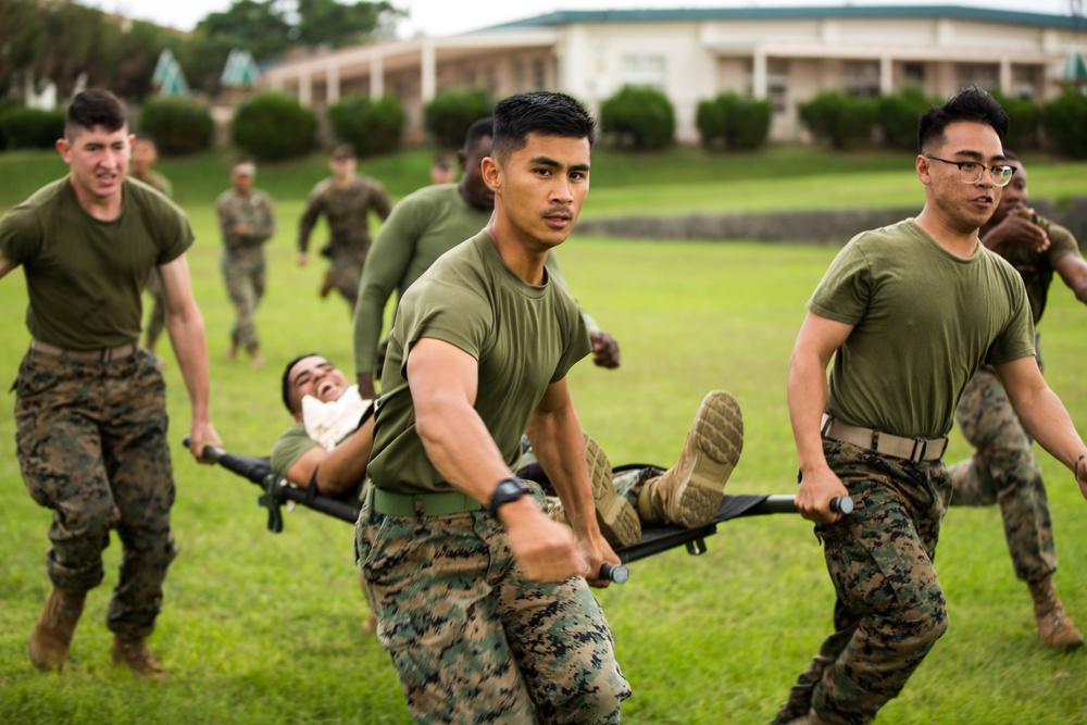 Marines with 3rd Marine Division compete in a field meet